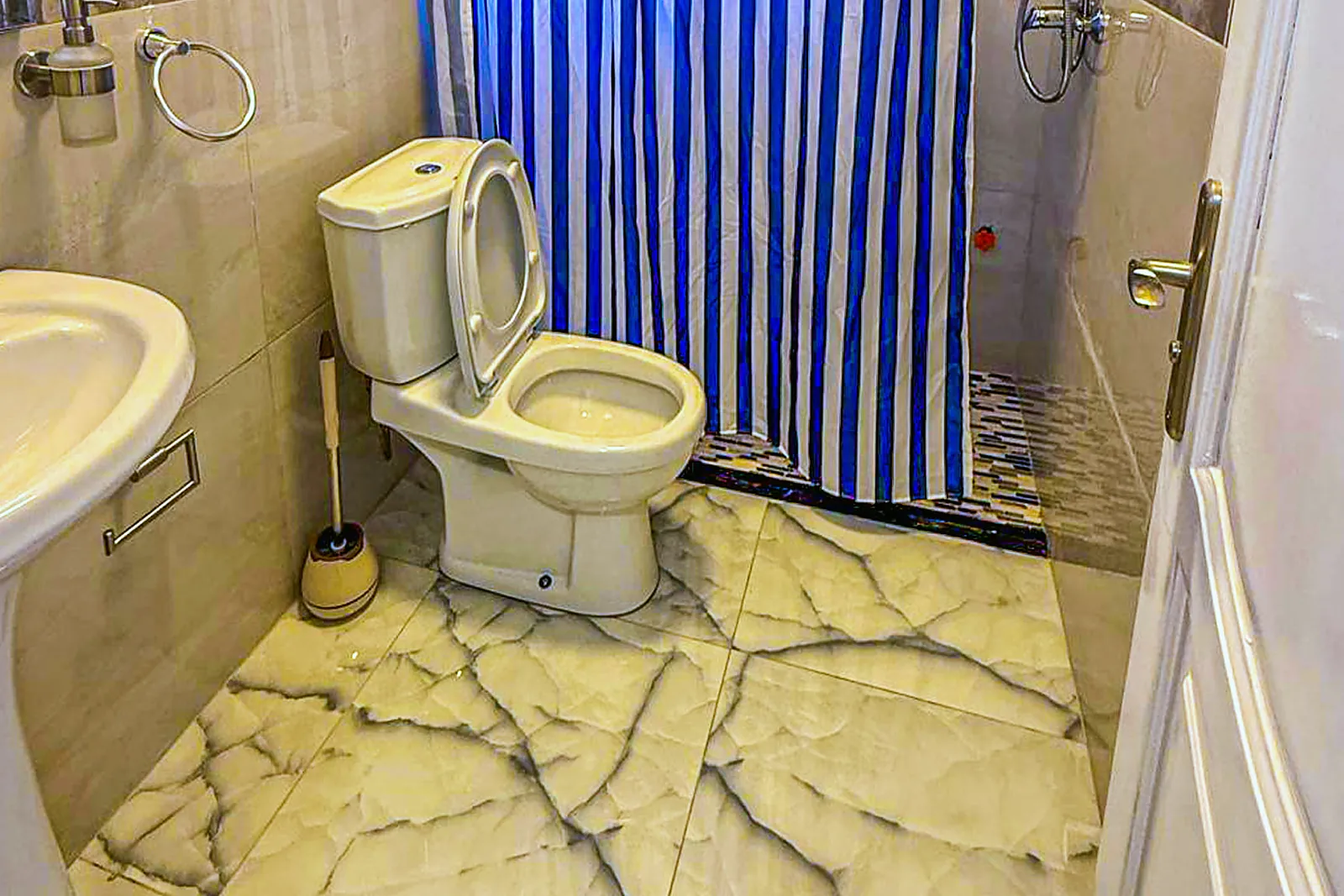 Bathroom with a marble floor