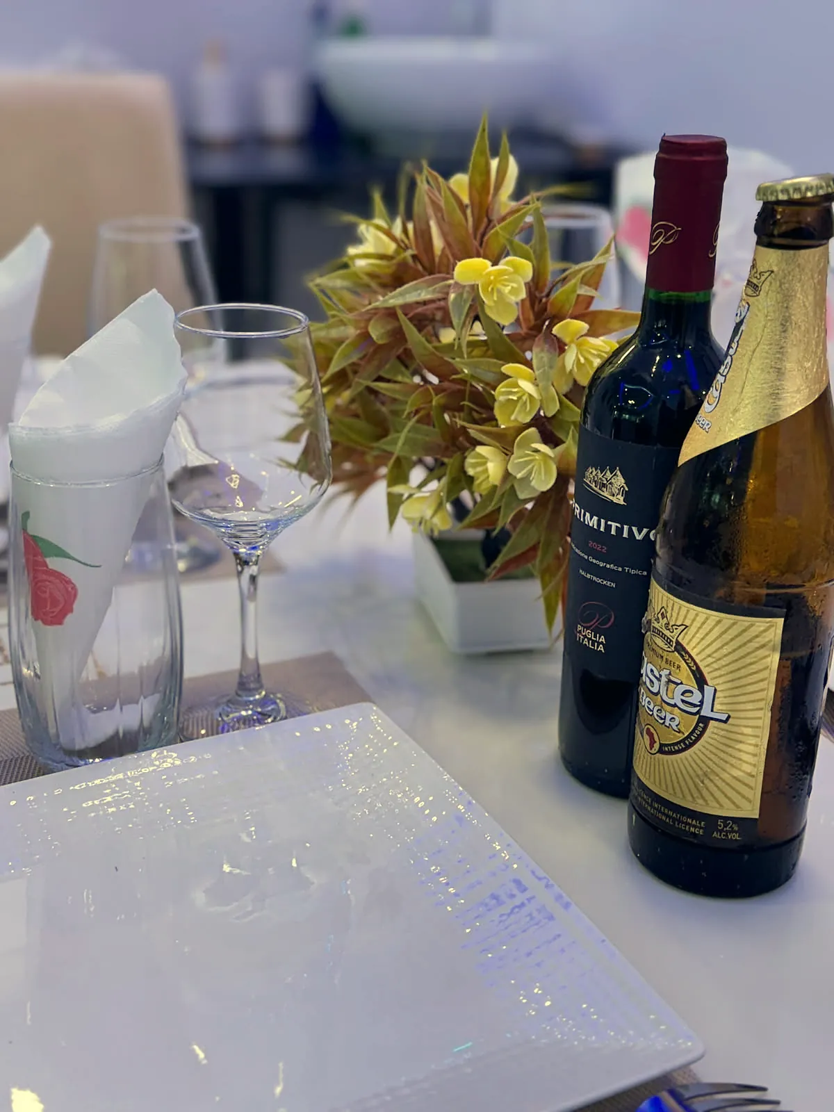 Glasses, wine and flowers on the table