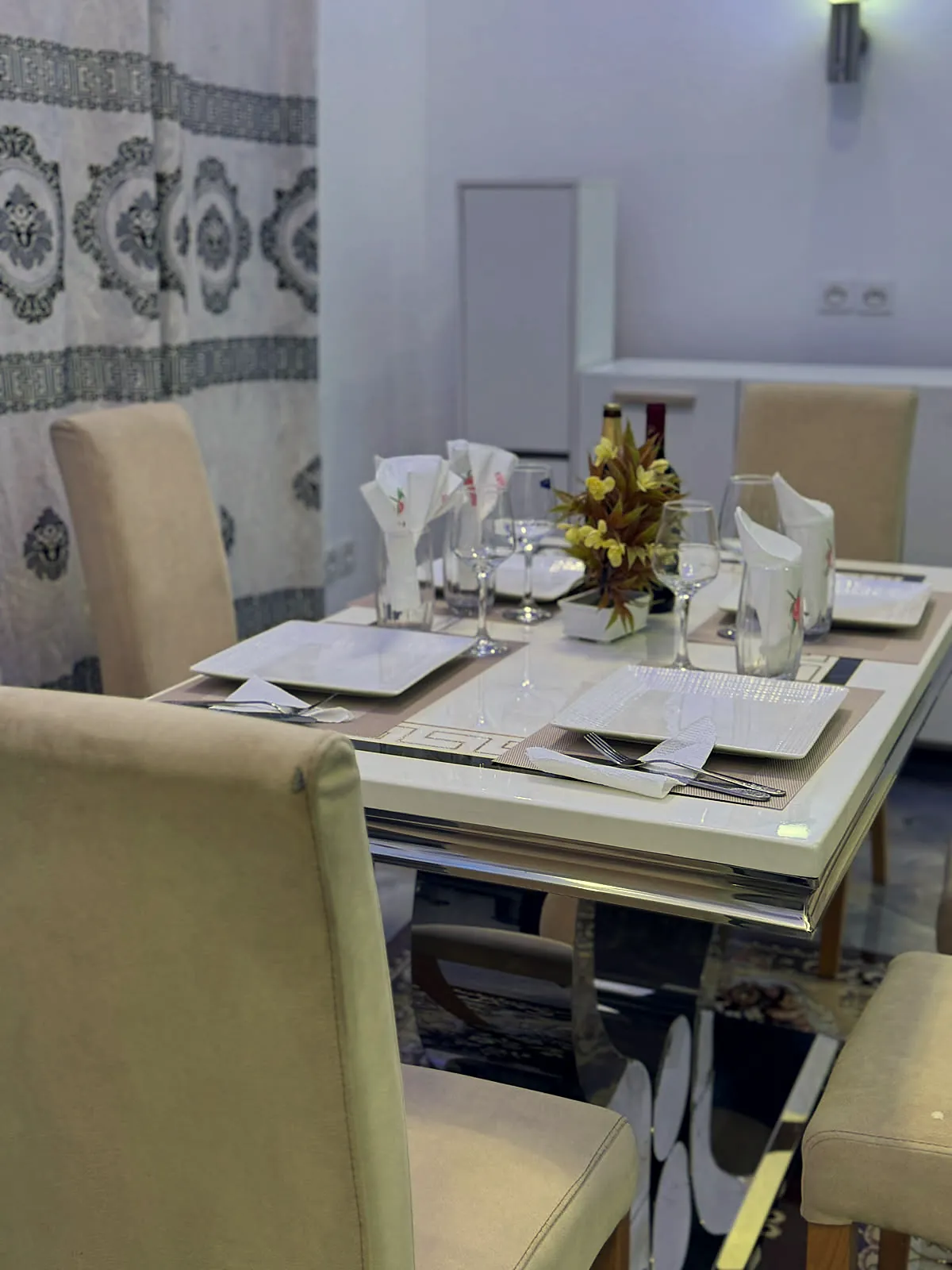 The dining table, laid for dinner