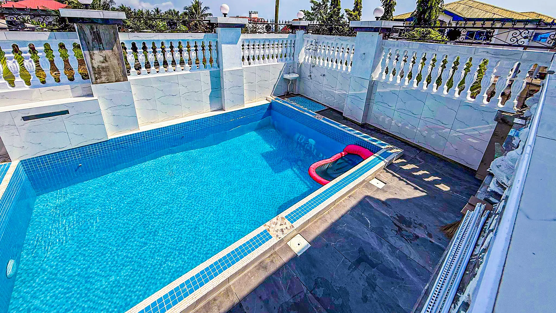 The pool on the roof terrace, above the rooftops of Limbola
