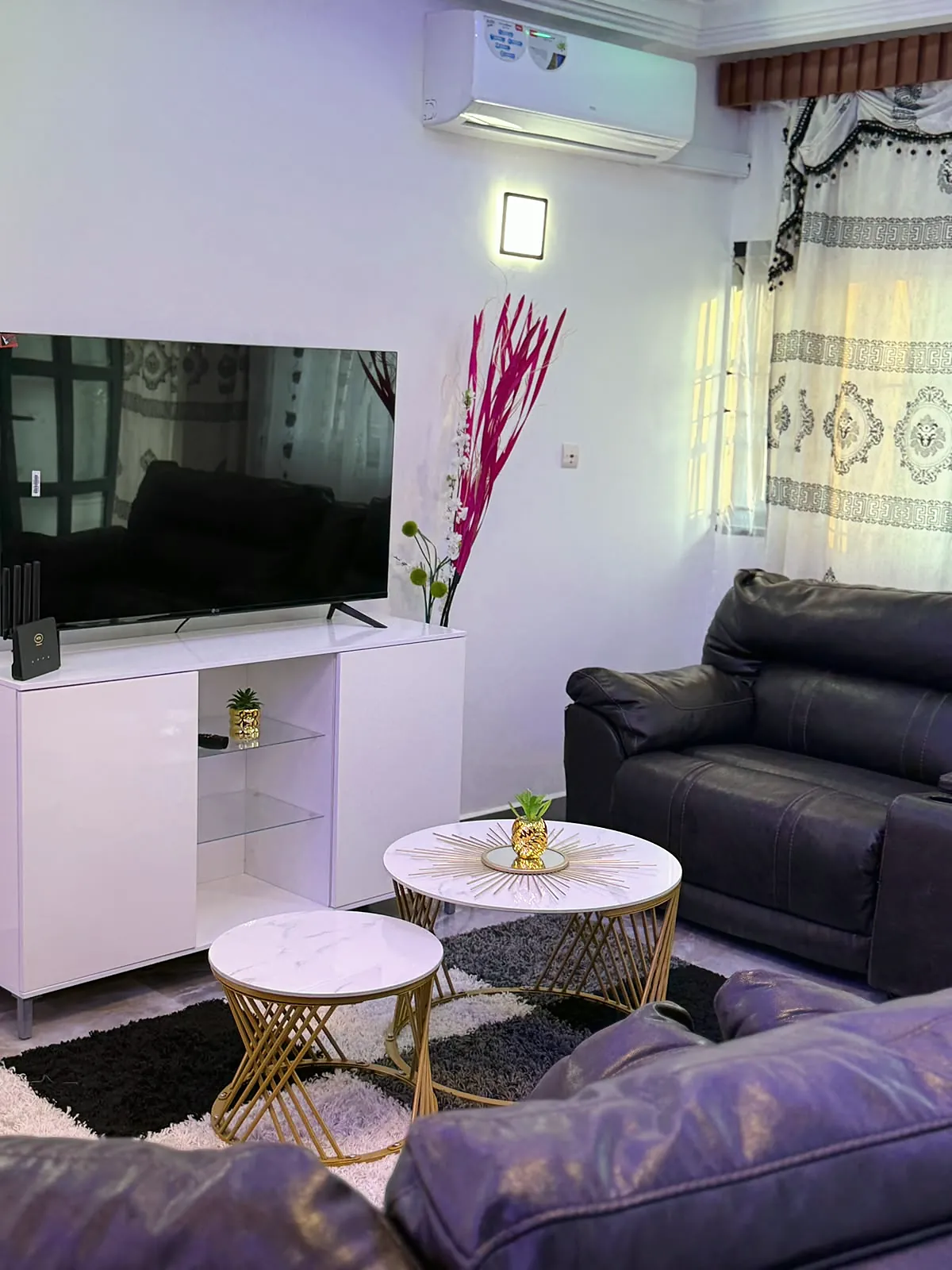 Sitting area with television and air conditioning