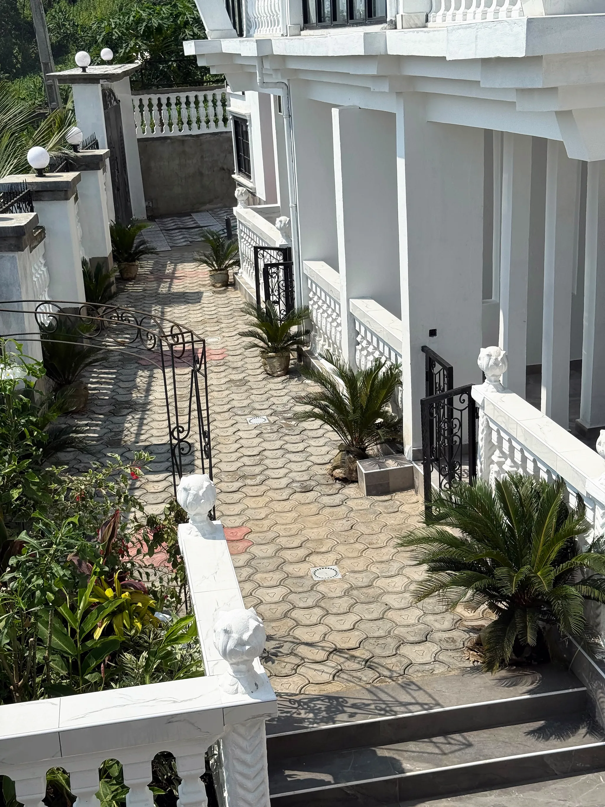 The paved walkway between the wings, seen from the upper floor